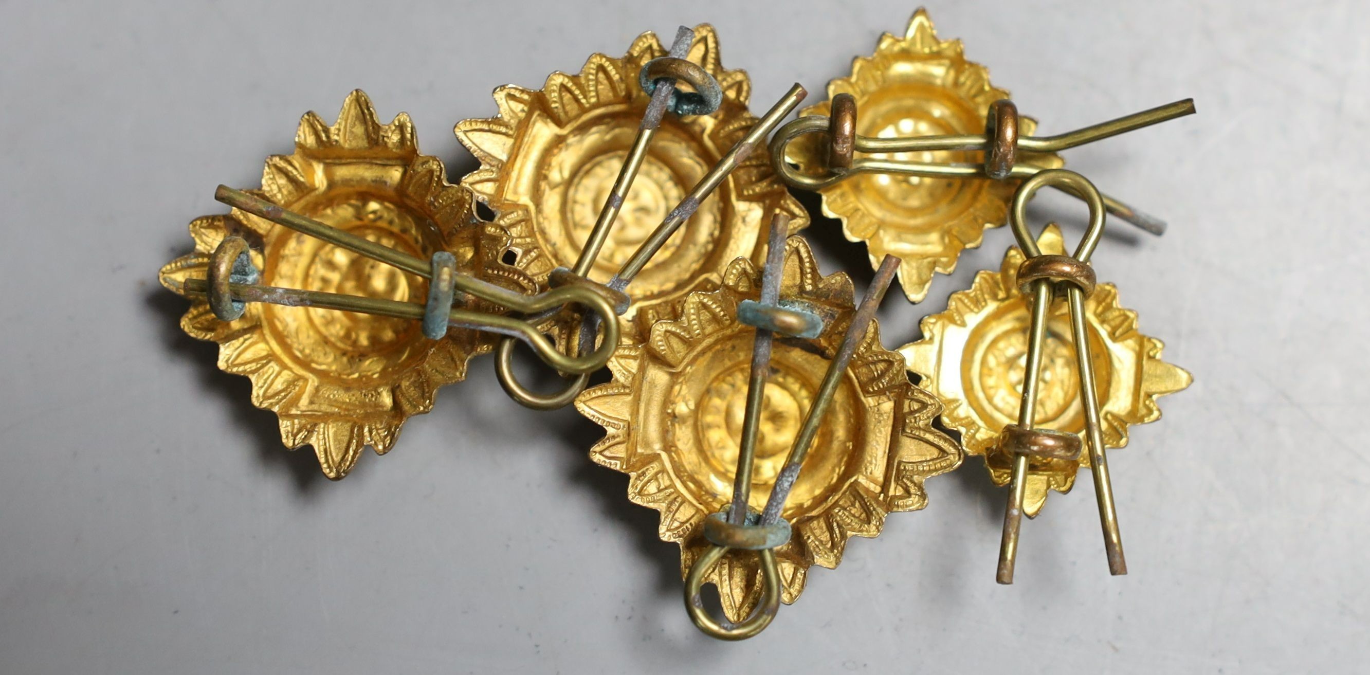 A group of five WW2 medals, together with a selection of cap badges and a GS Mk.II pocket watch